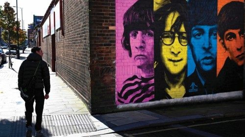 (FILES) Pedestrians pass a mural depicting members of British rock band The Beatles (L-R) Ringo ... (FILES) Pedestrians pass a mural depicting members of British rock band The Beatles (L-R) Ringo ...