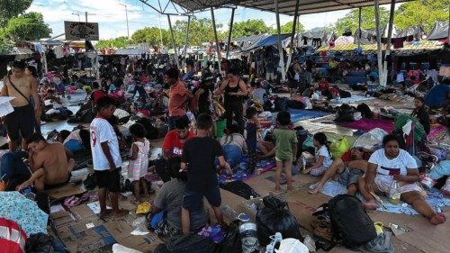 epa10963583 Migrants who are part of a caravan rest in a sports facility in the municipality of ...