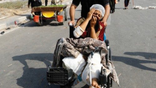 A Palestinian woman, who was injured in an Israeli strike and was staying at Al Shifa hospital, ...