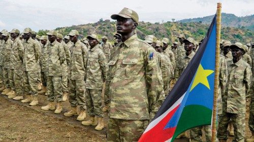 Soldiers belonging to the South Sudanese Unified Forces stand in formation during a deployment ...