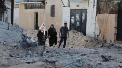 People check damage as they walk amid rubble after Israeli forces raided Jenin refugee camp in the ...
