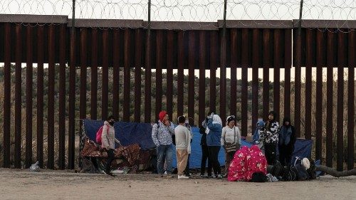 Migrants from Colombia camp at the U.S. side of the border wall after crossing the border into the ...