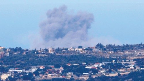 A picture taken from northern Israel on the border with Lebanon shows smoke billowing after an ... A picture taken from northern Israel on the border with Lebanon shows smoke billowing after an ...