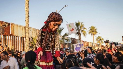 epa10961735 The puppet 'Little Amal' is surrounded by people upon her arrival at the border wall in ... epa10961735 The puppet 'Little Amal' is surrounded by people upon her arrival at the border wall in ...