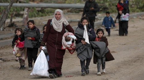 epa10999435 Palestinians walk after crossing from the northern Gaza Strip to the southern Gaza Strip ... epa10999435 Palestinians walk after crossing from the northern Gaza Strip to the southern Gaza Strip ...