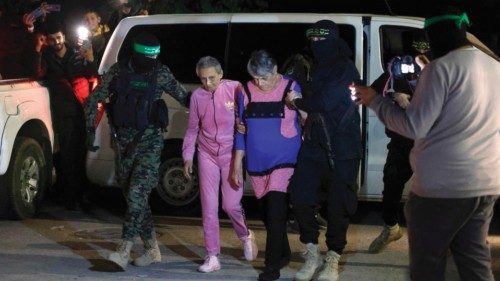 TOPSHOT - Hamas and Islamic Jihad fighters accompany newly released Israeli hostages, held since the ...