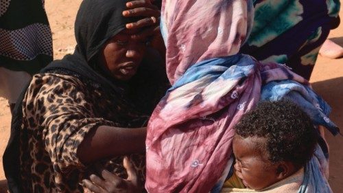 Women from El Geneina, West Darfur, await news of their missing relatives, as they gather near the ... Women from El Geneina, West Darfur, await news of their missing relatives, as they gather near the ...