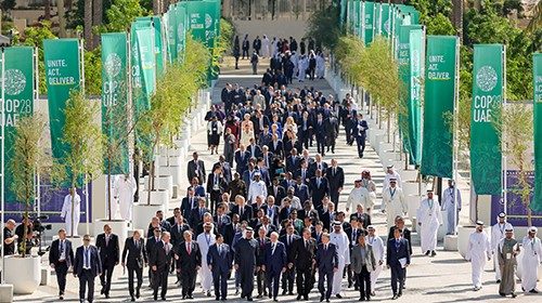 World leaders walk down Al Wasl after the group photo during the United Nations Climate Change ...