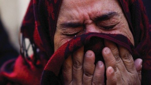 A Palestinian woman reacts at the site of an Israeli strike on a house, after a temporary truce ... A Palestinian woman reacts at the site of an Israeli strike on a house, after a temporary truce ...