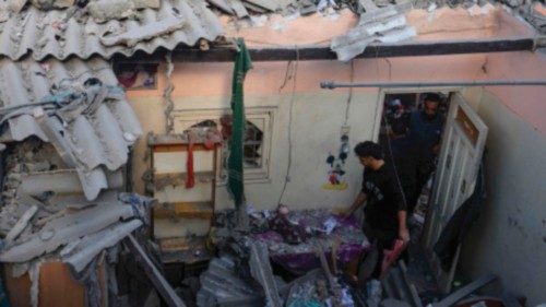 EDITORS NOTE: Graphic content / TOPSHOT - Palestinians check the damage of a house destroyed in an ... EDITORS NOTE: Graphic content / TOPSHOT - Palestinians check the damage of a house destroyed in an ...
