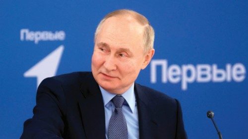 This pool photograph distributed by Russian state agency Sputnik shows Russia's President Vladimir ... This pool photograph distributed by Russian state agency Sputnik shows Russia's President Vladimir ...