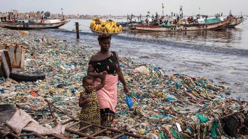 A woman walks with her daughter along Hann Bay in Dakar on September 29, 2023. Hann Bay, which ...