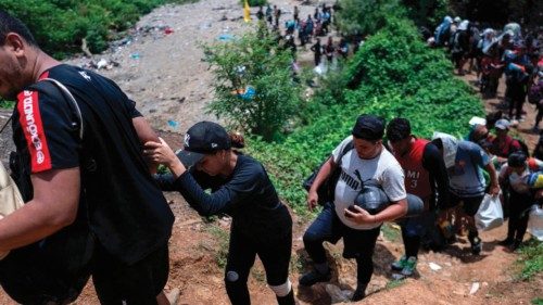 (FILES) Migrants walk by the jungle near Bajo Chiquito village, the first border control of the ... (FILES) Migrants walk by the jungle near Bajo Chiquito village, the first border control of the ...