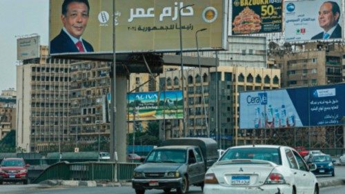 Motorists drive past campaign billboards of Egypt's President Abdel Fattah al-Sisi and presidential ...