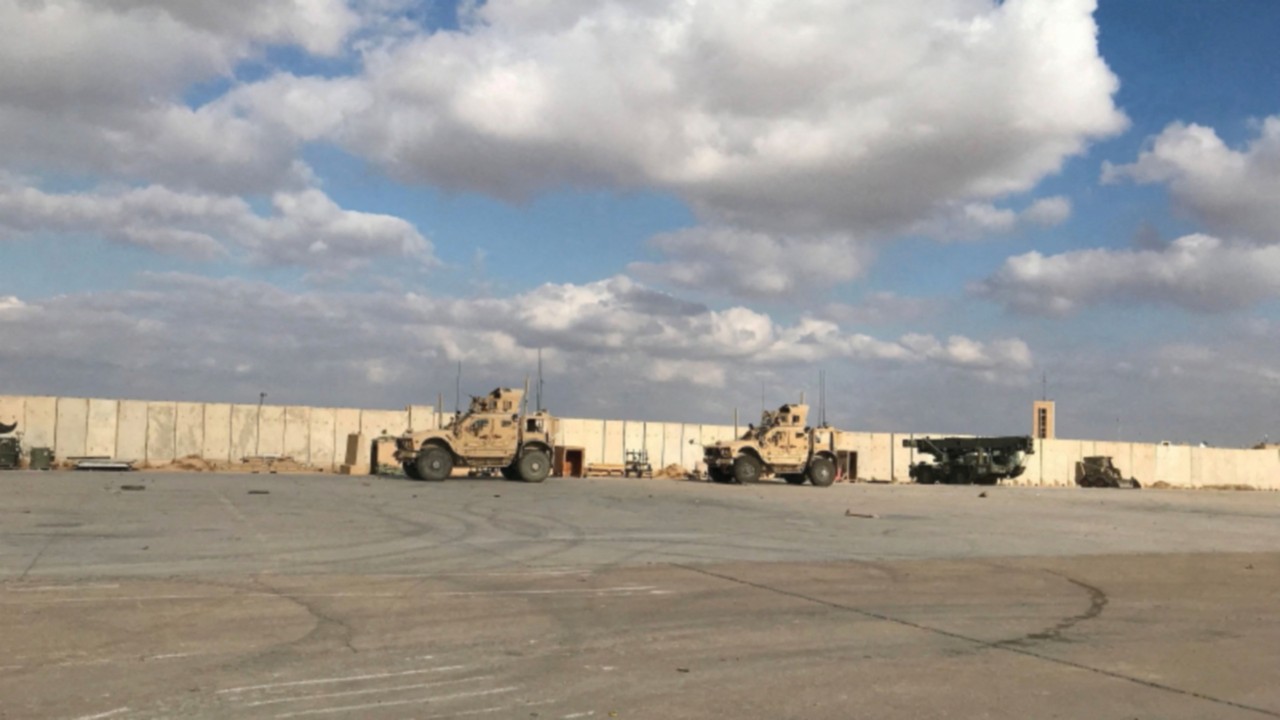 FILE PHOTO: Military vehicles of U.S. soldiers are seen at the al-Asad air base in Anbar province, ...