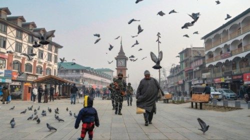 TOPSHOT - Indian paramilitary troopers patrol along a road in Srinagar on December 11, 2023, ahead ...