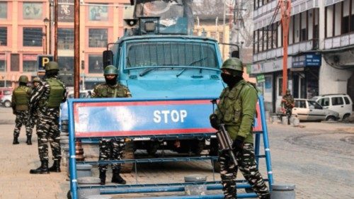 Indian paramilitary personnel stand guard along a road in Srinagar on December 11, 2023, ahead of ...