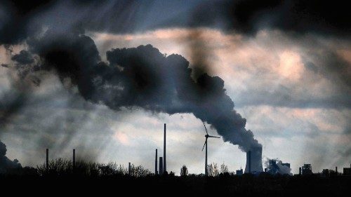 TOPSHOT - Vapor rises from a cooling tower of the lignite-fired power station operated by German ... TOPSHOT - Vapor rises from a cooling tower of the lignite-fired power station operated by German ...