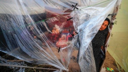A Palestinian woman looks out from her tent at a camp for displaced people in Rafah, in the southern ... A Palestinian woman looks out from her tent at a camp for displaced people in Rafah, in the southern ...
