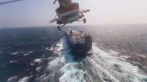 FILE PHOTO: Houthi military helicopter flies over the Galaxy Leader cargo ship in the Red Sea in ... FILE PHOTO: Houthi military helicopter flies over the Galaxy Leader cargo ship in the Red Sea in ...
