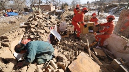 Rescue workers retrieve belongings from a damaged house at Shiyuan village following the earthquake ... Rescue workers retrieve belongings from a damaged house at Shiyuan village following the earthquake ...