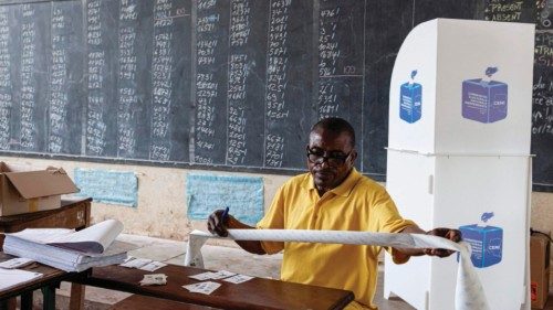 An official from the Independent National Electoral Commission (CENI) counts votes in a polling ... An official from the Independent National Electoral Commission (CENI) counts votes in a polling ...