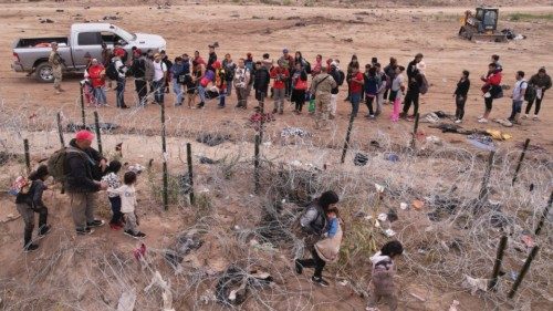 Migrants gather near the border after crossing the Rio Bravo river with the intention of turning ... Migrants gather near the border after crossing the Rio Bravo river with the intention of turning ...