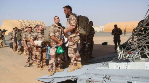 Soldiers of the last French troops in Niger prepare to board in a military plane as they prepare to ...
