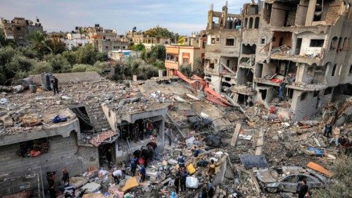 Men recover the body of a victim killed in the aftermath of an overnight Israeli strike at ... Men recover the body of a victim killed in the aftermath of an overnight Israeli strike at ...