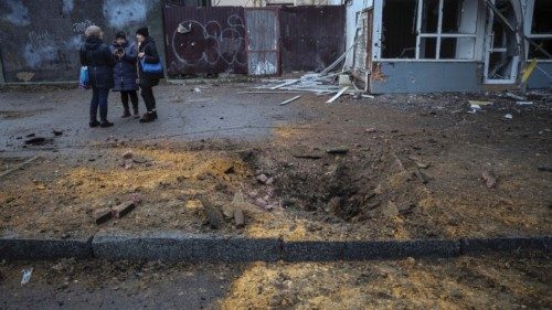 Local residents stand at a site of a yesterday's Russian military strike, amid Russia's attack on ... Local residents stand at a site of a yesterday's Russian military strike, amid Russia's attack on ...