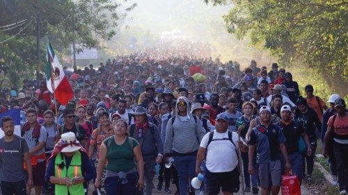 epa11045000 Migrants walk in a caravan heading to the northern border with the US, in the ...