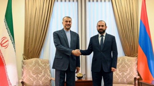 Armenia's Foreign Minister Ararat Mirzoyan (R) shakes hands with Iran's Foreign Minister Hossein ...