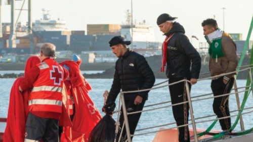 epa11045421 Red Cross and Rescue Navy members help some of the 40 Sub-Saharian immigrants at ... epa11045421 Red Cross and Rescue Navy members help some of the 40 Sub-Saharian immigrants at ...