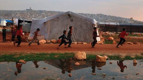 Syrian children walk as United Nations' World Food Program (WFP) deliver relief packages to ... Syrian children walk as United Nations' World Food Program (WFP) deliver relief packages to ...