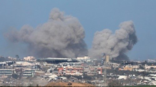 epa11047842 Smoke rises from the Shujaiya neighborhood in the Gaza Strip, following Israeli ...