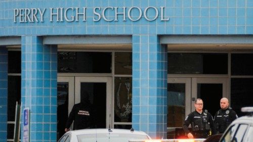 A medical examiner enters the school as police respond to a school shooting at the Perry Middle ... A medical examiner enters the school as police respond to a school shooting at the Perry Middle ...