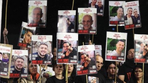 epa11061544 Supporters and families hold pictures of hostages held by Hamas in Gaza as they take ... epa11061544 Supporters and families hold pictures of hostages held by Hamas in Gaza as they take ...