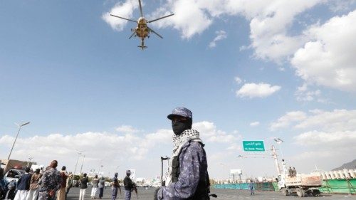 epa11059381 A Houthis-operated helicopter flies over Houthi troopers standing guard during a protest ... epa11059381 A Houthis-operated helicopter flies over Houthi troopers standing guard during a protest ...