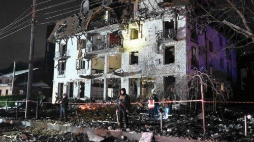 TOPSHOT - Rescuers cordon off the area surrounding a destroyed hotel following a missile strike in ... TOPSHOT - Rescuers cordon off the area surrounding a destroyed hotel following a missile strike in ...