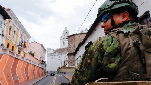 Members of the Armed Forces patrol a street during an operation to protect civil security in Quito, ...