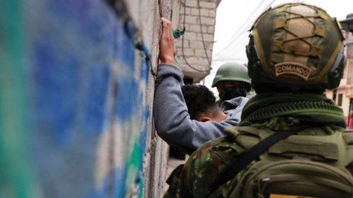 Members of the armed forces of Ecuador search a man during a security operation in the neighborhood ... Members of the armed forces of Ecuador search a man during a security operation in the neighborhood ...