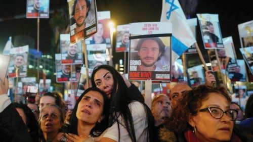 Demonstrators react at a 24-hour protest, calling for the release of Israeli hostages in Gaza and ...