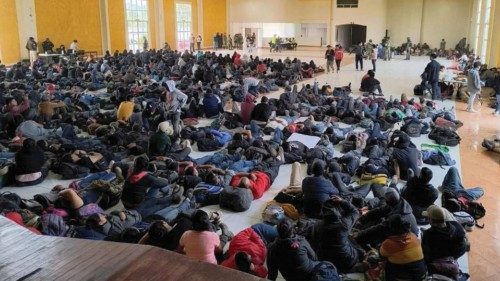 Migrants found by Mexican authorities in a warehouse, rest at the municipal auditorium, in ...