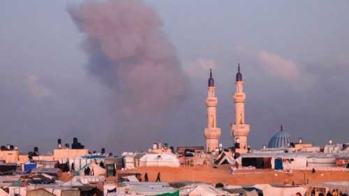 TOPSHOT - A picture taken from a makeshift camp for displaced Palestinians on the west of Rafah near ... TOPSHOT - A picture taken from a makeshift camp for displaced Palestinians on the west of Rafah near ...