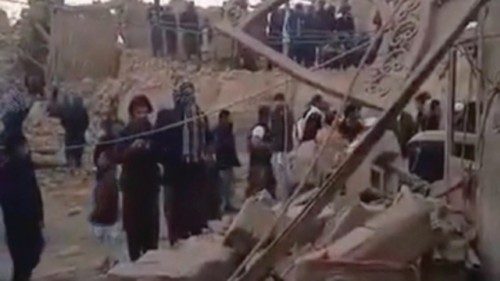 People gather near rubble in the aftermath of Pakistan's military strike on an Iranian village near ... People gather near rubble in the aftermath of Pakistan's military strike on an Iranian village near ...