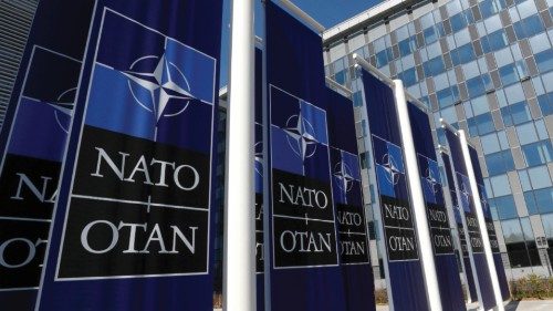 FILE PHOTO: Banners displaying the NATO logo are placed at the entrance of new NATO headquarters ... FILE PHOTO: Banners displaying the NATO logo are placed at the entrance of new NATO headquarters ...