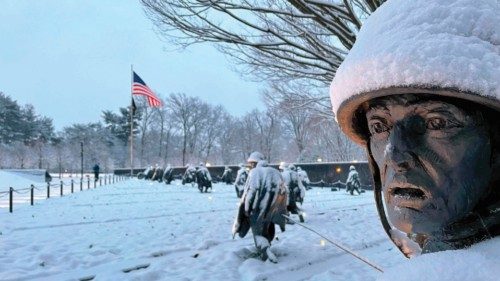 Statues at the Korean War Veterans Memorial on the National Mall are covered in snow during a storm, ...