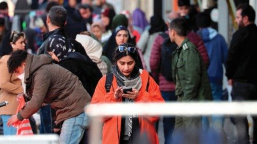 An Iranian woman checks his phone in a street in Tehran on January 18, 2024. Pakistan launched ... An Iranian woman checks his phone in a street in Tehran on January 18, 2024. Pakistan launched ...