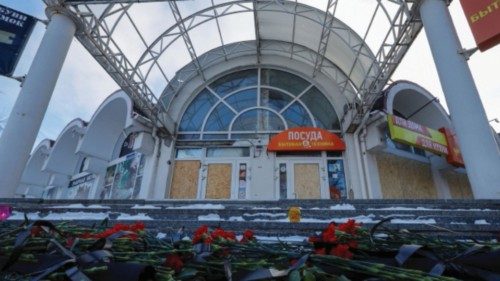 A view shows flowers at a market, which were brought by people in memory of victims killed by recent ... A view shows flowers at a market, which were brought by people in memory of victims killed by recent ...