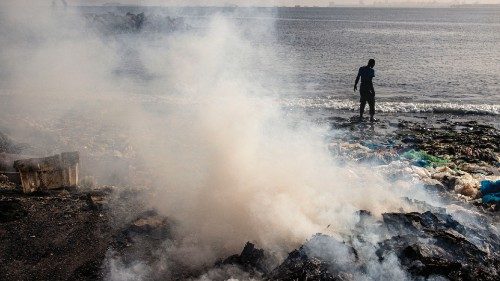 A man stands in the ocean along Hann Bay in Dakar on November 3, 2023. Hann Bay, which stretches ... A man stands in the ocean along Hann Bay in Dakar on November 3, 2023. Hann Bay, which stretches ...